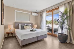 Ένα ή περισσότερα κρεβάτια σε δωμάτιο στο Villa Sol Paraiso +194 φωτογραφίες