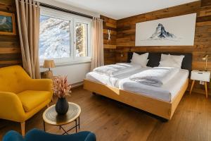 Ένα ή περισσότερα κρεβάτια σε δωμάτιο στο Mattertal Lodge +49 φωτογραφίες