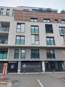 an apartment building on the corner of a street at Elegant Urban Retreat - City Center in Arad