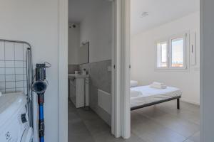 a hospital room with a bed and a window at Casa Dalia in Garbagnate Milanese +29 photos