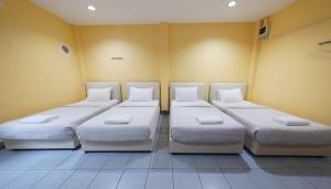 Postel nebo postele na pokoji v ubytování Excel Hotel Bangkok former Sri Krungthep Hotel