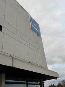 a building with a sign on the side of it at Hotel Lotus in Reykjavík