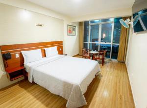 Ένα ή περισσότερα κρεβάτια σε δωμάτιο στο Hotel INTI TUMI