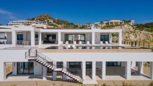 an aerial view of a house with a swimming pool at Poco Paraiso in San José del Cabo +45 photos