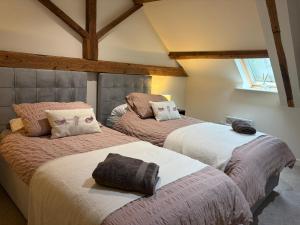 Ένα ή περισσότερα κρεβάτια σε δωμάτιο στο The Stables