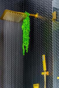 a green plant on a pole with a cross at Jungle House Columbus Short North Downtown Free Parking - Walk to Convention Center & Nationwide Arena - 4BR Luxury Home - Sleeps 20 - Over 5,800 Five Star Stays in Columbus