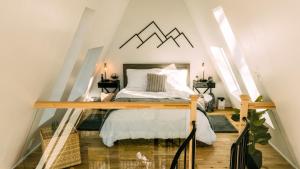 a bedroom with a bed in a attic at The Pinnacle in Logan
