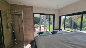 A bed or beds in a room at Secret de campagne Spa