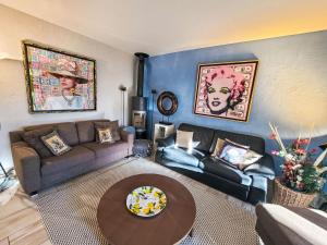 a living room with a couch and a table at Apartment Collina Verde B by Interhome in Ascona