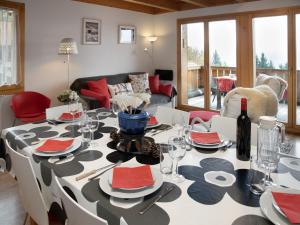 a dining room with a table with plates and wine glasses at Apartment Racer's Retreat Apt-12 by Interhome in Wengen +46 photos