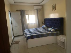 Ένα ή περισσότερα κρεβάτια σε δωμάτιο στο Paradis a Thies