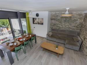 a living room with a table and a couch at Holiday Home Sol Cambrils Park 28 by Interhome in Cambrils
