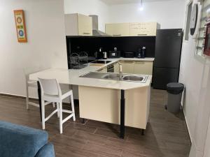 a kitchen with a sink and a counter top at La Casa Moueza in Le Vauclin