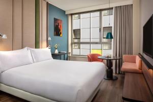 Voodi või voodid majutusasutuse NH Barcelona Diagonal Center toas