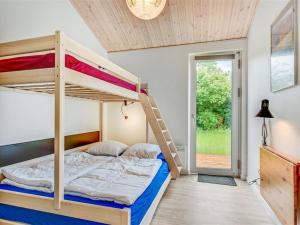 Una cama o camas en una habitación de Holiday Home Snari - 700m from the sea by Interhome