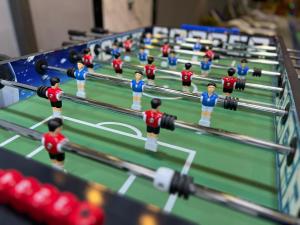 a model of a table with a group of people in a wrestling match at Bellagio Chaleht in Al Rama +3 photos