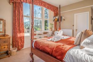 Ένα ή περισσότερα κρεβάτια σε δωμάτιο στο The Mortal Man Inn