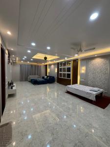 a large living room with a bed and a couch at DeeHa Niwas Luxe -Modern Luxury 1BHK in City Centre in Varanasi