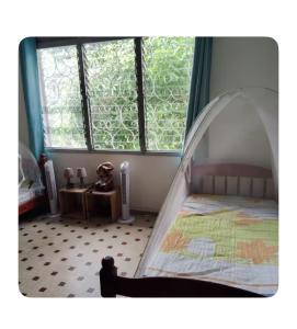 En eller flere senge i et værelse på Haut de maison à Deshaies proche de Grande Anse