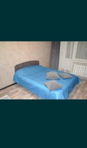 Ένα ή περισσότερα κρεβάτια σε δωμάτιο στο Ауельбекова 53 +1 φωτογραφίες