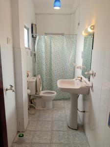 a bathroom with a sink and a toilet and a shower at N S Apartment in Mount Lavinia +22 photos