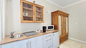 Η κουζίνα ή μικρή κουζίνα στο 7 Wilde Olyf Street +1 φωτογραφίες