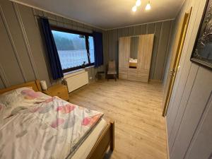 Ένα ή περισσότερα κρεβάτια σε δωμάτιο στο Ferienwohnung Susanna +20 φωτογραφίες