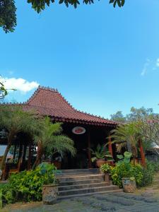 Un jardín fuera de Niti Bhumi Villa