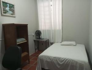 Una cama o camas en una habitación de Dom Victor Residence Hotel 2