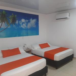 Ένα ή περισσότερα κρεβάτια σε δωμάτιο στο Mare Mare Hotel