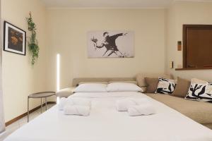 Ένα ή περισσότερα κρεβάτια σε δωμάτιο στο PrimoPiano - Don Gnocchi