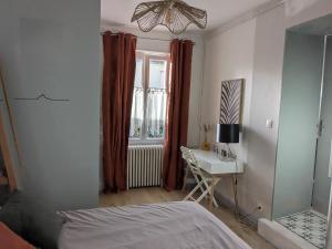 Postel nebo postele na pokoji v ubytování La corderie du Lude