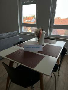 a white table with a plant on top of it at Ferienwohnung Maichingen in Sindelfingen