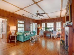a living room with a couch and a table at Elsewhere on Tybee in Tybee Island