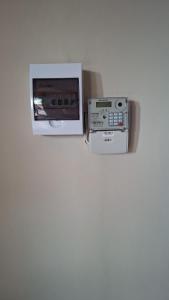 a microwave and a toaster oven on a wall at MDA Myburgh in Brackenfell +8 photos