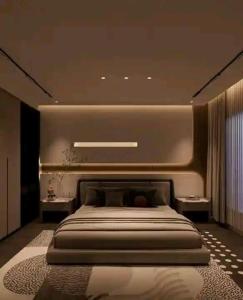 a bedroom with a large bed and two tables at Accomodation bnb in Ruiru