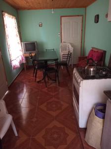 a kitchen with a stove and a table in a room at Casa Aleluna in Villa Giardino +19 photos