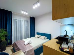 a bedroom with a bed in a room at AmaMolto Gardens in Wrocław