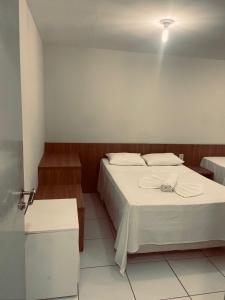 Ένα ή περισσότερα κρεβάτια σε δωμάτιο στο Portal do Atlântico +178 φωτογραφίες