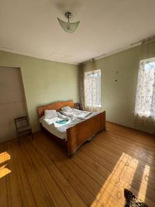 Ένα ή περισσότερα κρεβάτια σε δωμάτιο στο -L0RIA-Guest House