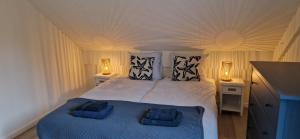 Voodi või voodid majutusasutuse Hottub cottage deluxe, BBQ, 6p aan meer Gelderland toas +74 fotot