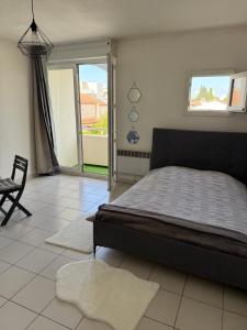 Postel nebo postele na pokoji v ubytování Montpellier : Jolie studio très calme