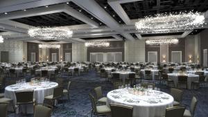 a ballroom with tables and chairs and chandeliers at Signia by Hilton Orlando - An Official Walt Disney World Hotel in Orlando +88 photos