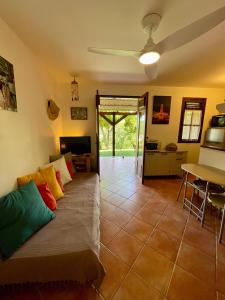 a living room with a couch and a table at Les Sucriers in Les Anses-dʼArlets
