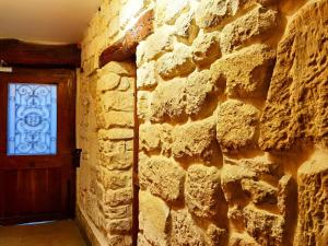 a brick wall with a door and a window at Studio Near Metro & Marais & Hotel de Ville & Seine in Paris