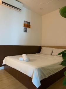 Postel nebo postele na pokoji v ubytování Nạ House - Homestay Đất Cảng + 4 fotografie