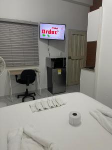 Postel nebo postele na pokoji v ubytování Hotel Orduz Centro Histórico de Cali