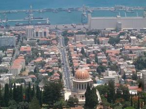 an aerial view of a city with a building at The Colony - By Lime Luxe in Haifa