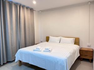 Voodi või voodid majutusasutuse บ้านแม่เกสต์เฮ้าส์ Bann Mae toas