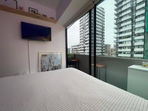 Ένα ή περισσότερα κρεβάτια σε δωμάτιο στο casahotel lof Arequipa